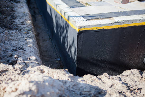Professional Waterproofing technician working in Orient, NY